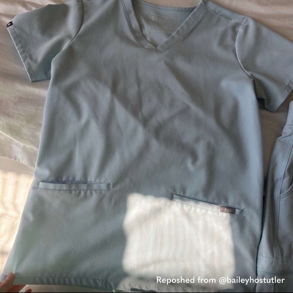 FIGS Women's Scrub top in Light Blue.